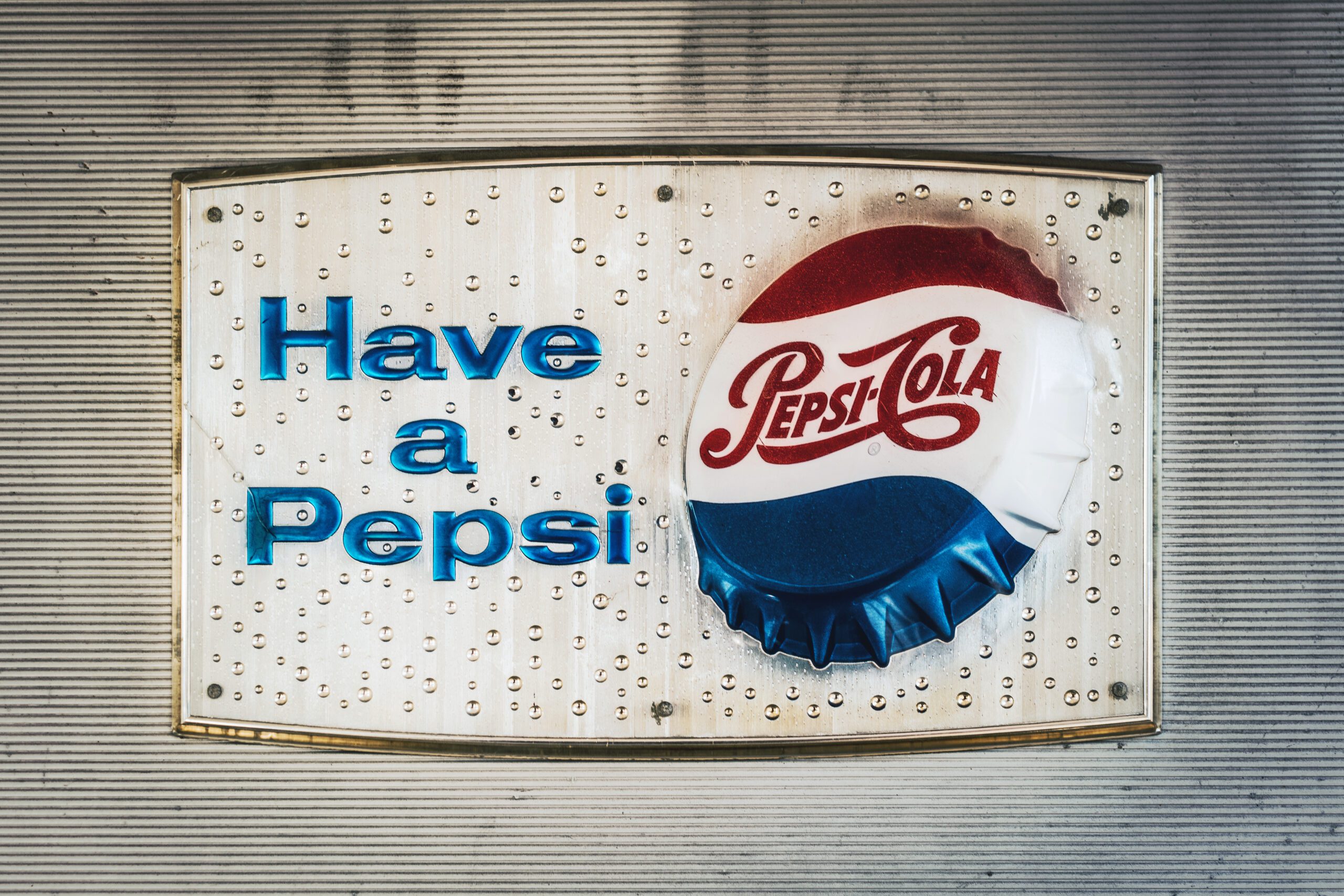 Pepsi cola can on blue plastic bag
